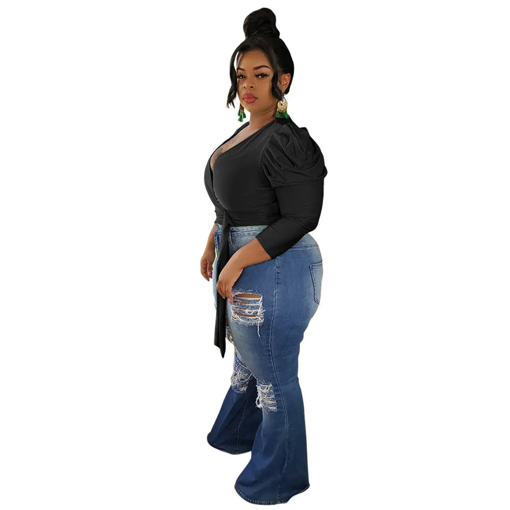 V-neck blouse with crossed shoulders and puffed shoulders