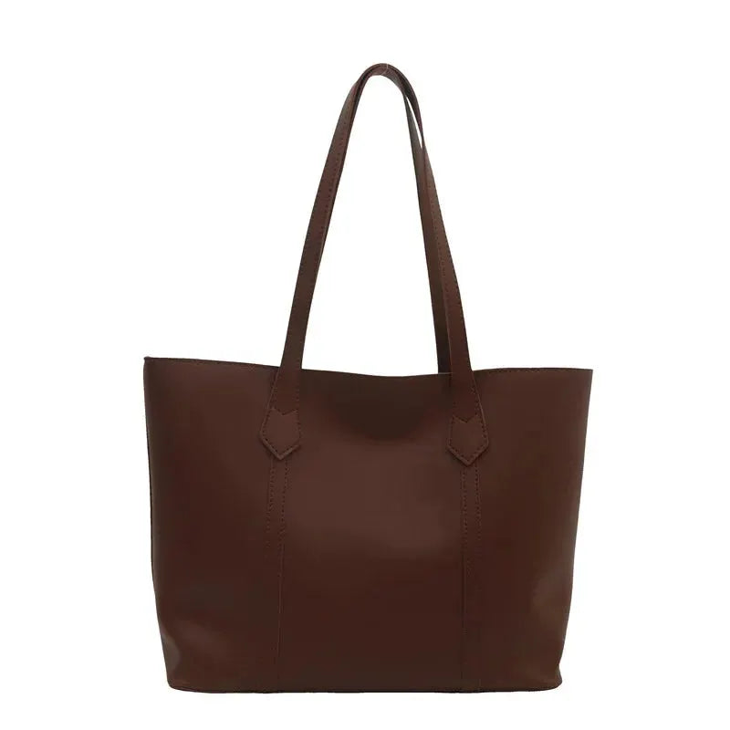 Elegant Women's Shoulder Bag with Sturdy Handles and Spacious Design