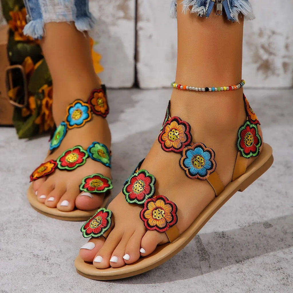 Flat sandal with decorative strap