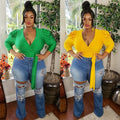 V-neck blouse with crossed shoulders and puffed shoulders