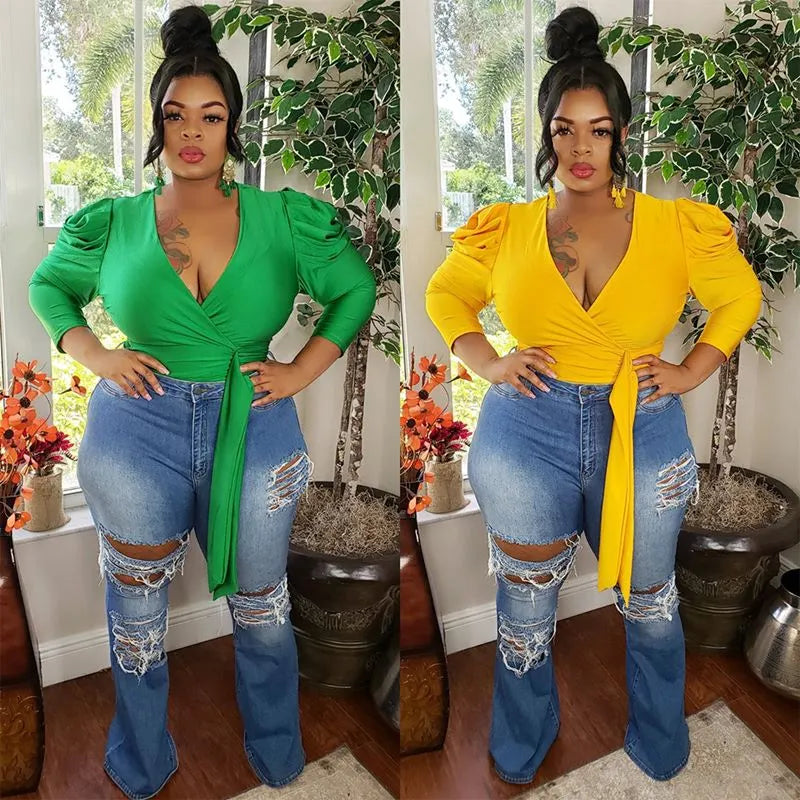 V-neck blouse with crossed shoulders and puffed shoulders