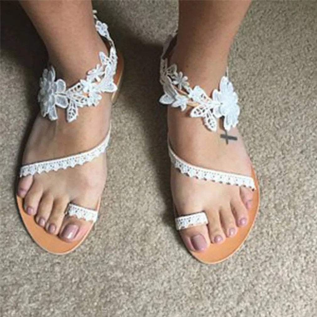 Damen Spitzensandalen mit Blumenmuster und flacher Sohle