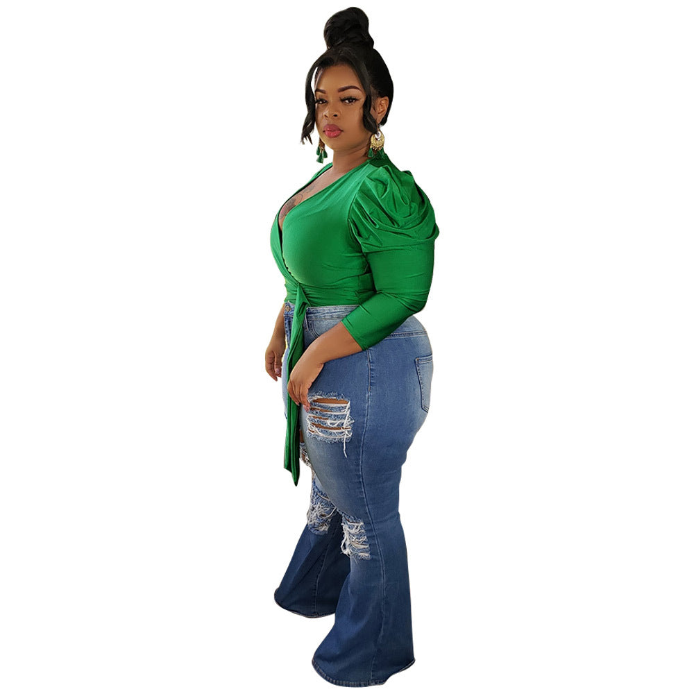 V-neck blouse with crossed shoulders and puffed shoulders
