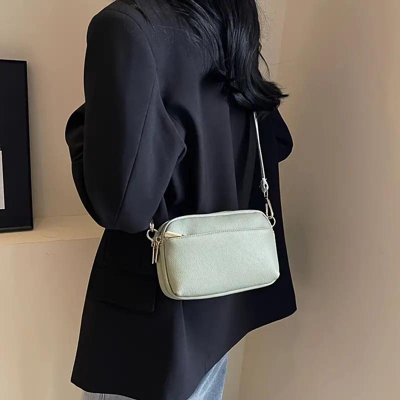 Moderne Crossbody Handtasche mit Musterriemen